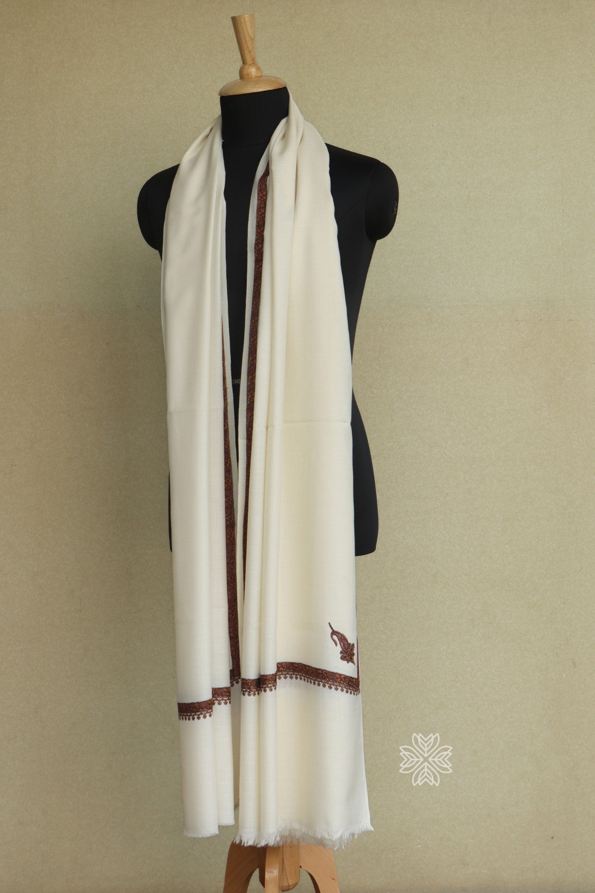 White scarf with brown trim
