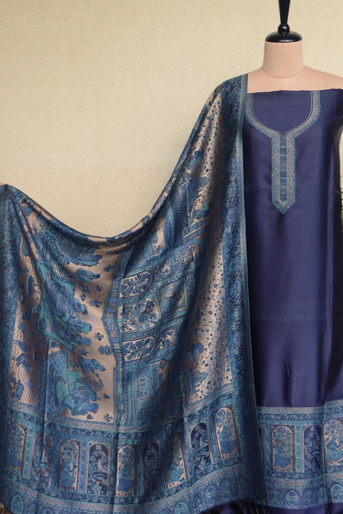 A navy blue three-piece ethnic suit set with zari moonlight figure dupatta