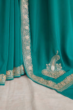 Green Crepe Silk Saree with metallic embroidery