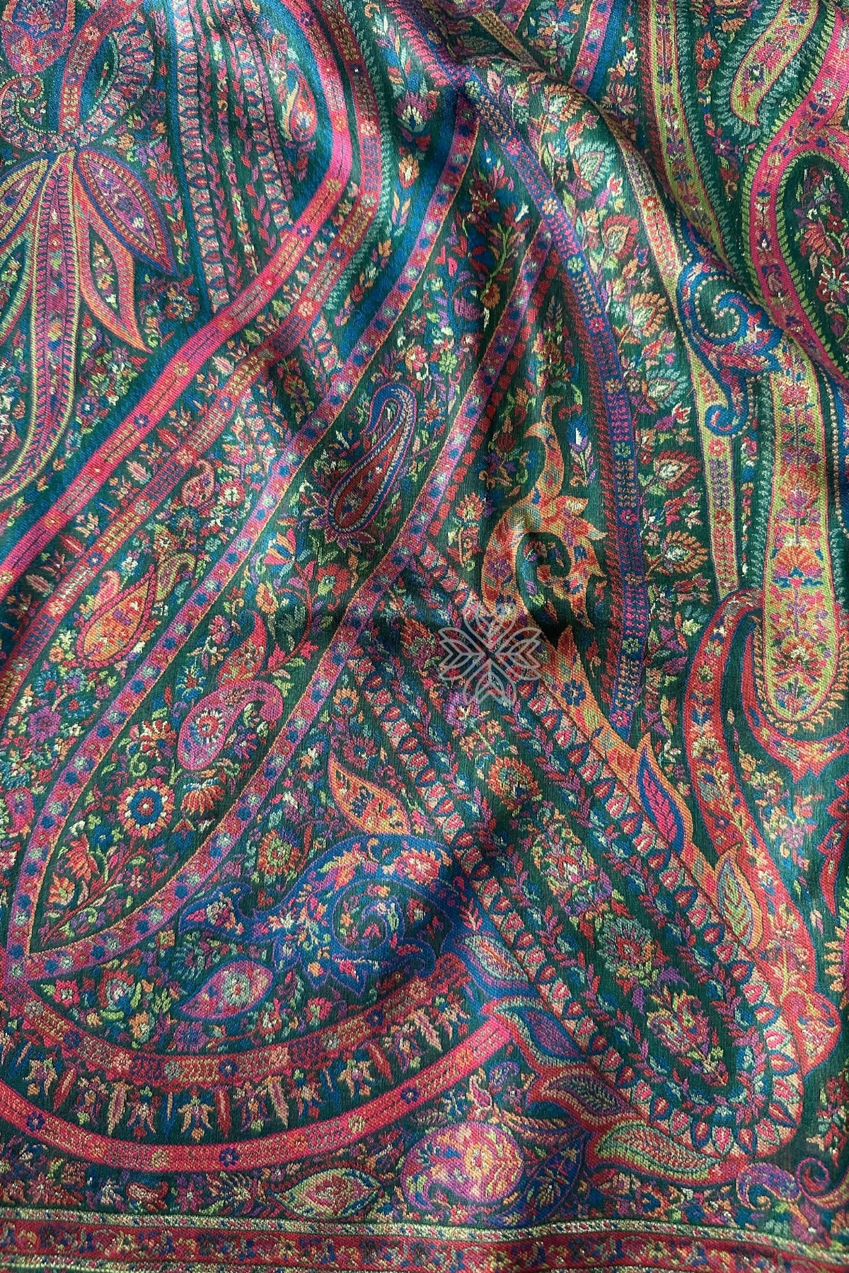 Close-up of colorful paisley patterned fabric Green Kani Jamawar Silk Saree
