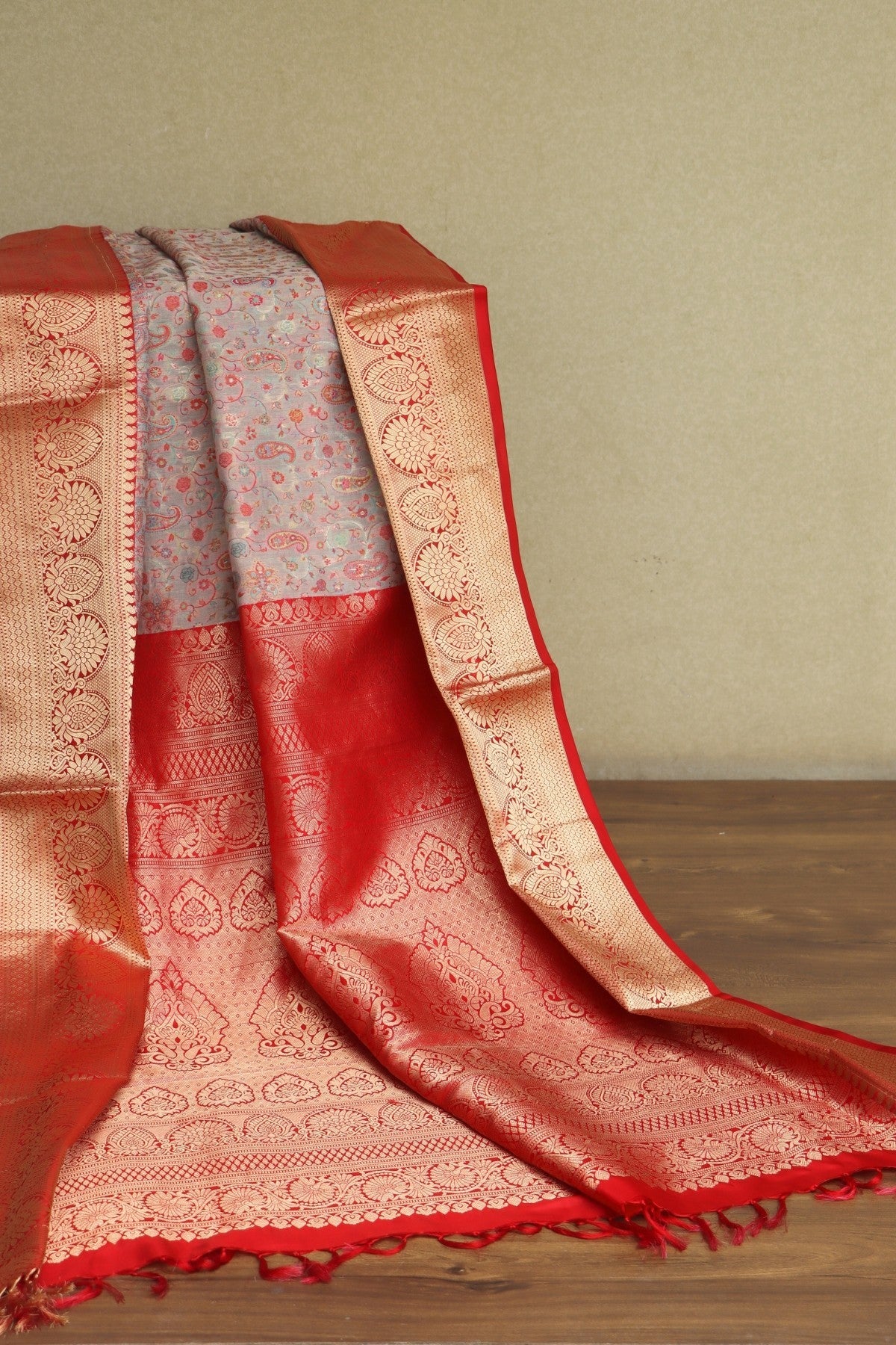 Kani Red and gold saree with intricate patterns 