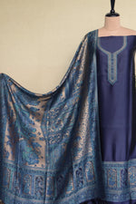 A navy blue three-piece ethnic suit set with zari moonlight figure dupatta