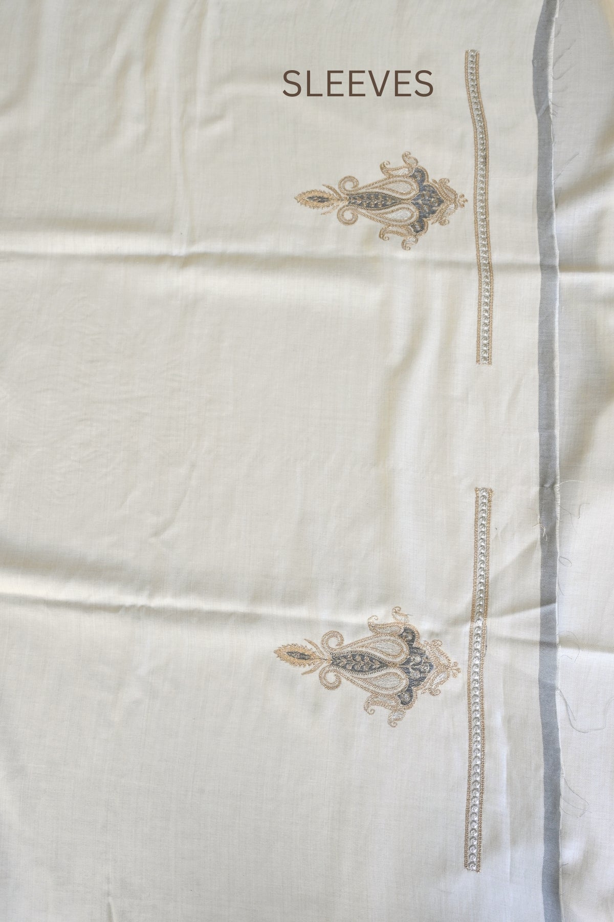 Off White Fine Wool Zari Embroidered Unstitched Suit