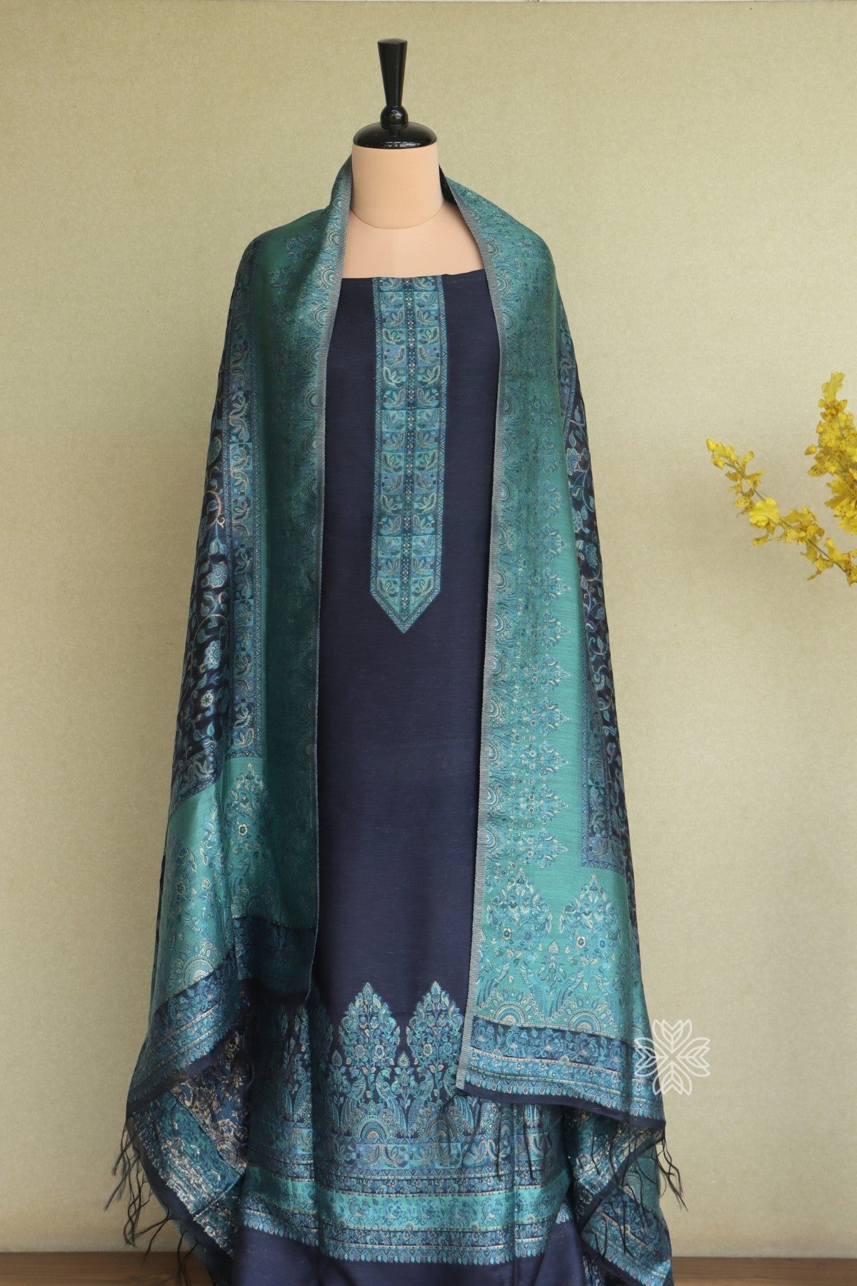 Navy blue traditional dress with a green patterned shawl
