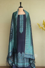 Navy blue traditional dress with a green patterned shawl